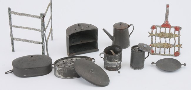 Early German Tin Kitchenware: circa early 1800's, lot includes functioning sifter, steamer with grate, coffee pot, plate, food carrier and cover along with pewter drying rack and painted soft metal fish grate steamer 2" l.