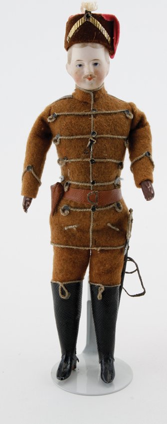Simon & Halbig Soldier: painted and molded bisque with blue eyes, mustache, hands painted brown to resemble gloves (some wear to paint) and exceptional original mohair uniform with sword and spurs (missing 1) appr. 7.25" t.