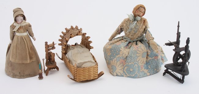 Miniature Spinning Wheels, Nut Doll & Cradle: early group includes 2 upright form spinning wheels with treadles, a small ivory/bone thread holder, a home crafted doll with painted nut head, painted bisque doll in rigid cone skirt marked ÒBonbons