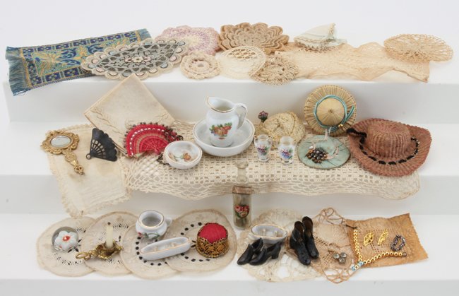 Miniature Dolls' House Linens & Ladies Accessories: various ladies items including beveled hand mirror, porcelain chamber set, ormolu candle holder and pin cushion, 2 small fans, 4 hats, shoes, some faux jewels, Milfiori paperweight, potpourri bottle a