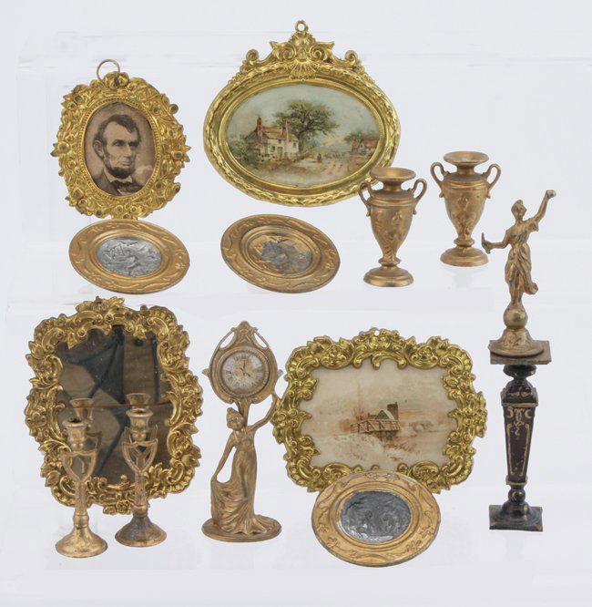 Ormolu & Gilt Figural Clock, Frames, etc,: German, circa mid to later 1800's, gilt soft and cast metal dolls' house accessories including figural clock, pair of urns and candlesticks, lady liberty figure on pedestal, 3 wall chargers, and 4 Erh
