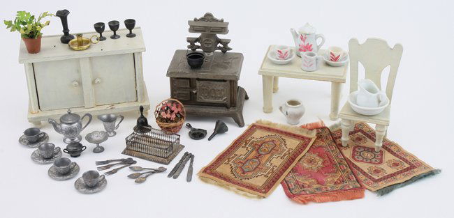 Dolls' House Kitchen Grouping: mostly late 19th/early 20th centuries, various makers, "Dot" cast iron stove, painted wood table, chair and cupboard, pewter flatware, plates, cups and goblets, ceramic pitchers and bowls and 3 printe
