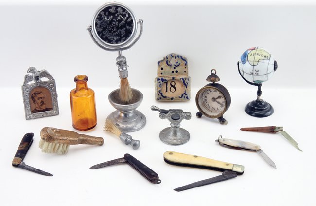 Gentleman's Dolls' House Miniatures: accessories for the gent in your small house, included is a mirrored shaving stand with brush holder and extra brush, amber medicine bottle, a cigar cutter, calendar, glass marble globe, 2 folding str