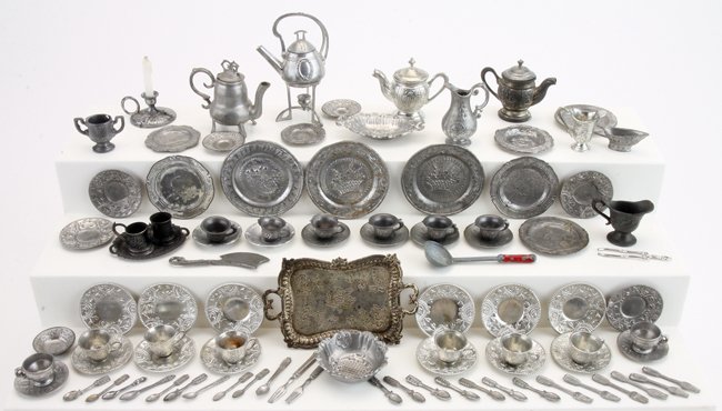 Miniature Pewter Tea Sets & Tableware: included are chargers, tea pot on warming stand, several sets of cups and saucers, tea pots, creamers, ewer, serving bowls, flatware and utensils chargers 1.75" diam.