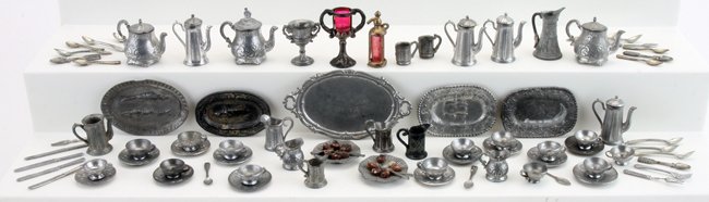 Smaller Scale Miniature Pewterware: tableware grouping that includes flatware, serving platters, tea cups and saucers, tea pots, tankards and pitchers largest tea pot .75" t.