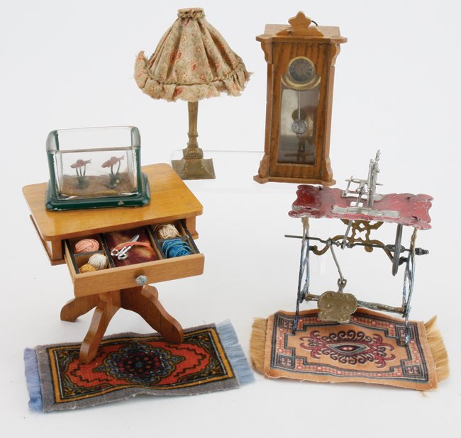 Sewing Table, Clock & Sewing Machine: stained soft metal sewing machine, gilt lamp with fabric shade, glass and wood cased wall clock, glass fish tank and Schneegas sewing table with compartmented drawer table 3.25" t. x 3" w.
