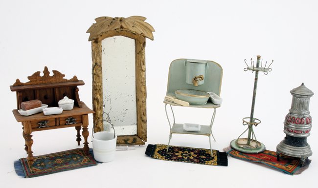 Dolls' House Bath Accessories: Ernst Plank painted tin wash stand with wood basin, painted tin coat rack, painted cast metal stove, stained wood side table with porcelain soap dishes, pail and trinket trays, gilt wood mirror and 3