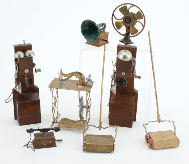 Miniature Phones, Fan, etc.: necessities for your miniature house include phonograph, fan, desk telephone, 2 Schweitzer sweepers, sewing machine and 2 Erhard & Sohne wall phones phones 4.5" t.