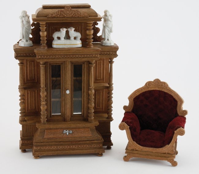 Ornate Victorian Cabinet & Chair: high Victorian styled solid and pressed wood design display cabinet with tiered shelves, glass front doors and turned wood columns and arm chair with sculpted velvet upholstery; These items are offere