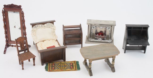 Dolls' House Bedroom Grouping: tin fireplace with mantel and several stained wood pieces including bed, dressing mirror with pressed wood design, slant front desk, chair, table and music/book stand bed 6" l. x 3.5" t.