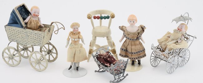 Bisque Dolls & Carriages: German painted wood high chair, painted tin carriage (Ernst Plank) and soft metal filigree carriage both with jointed bisque babies, cradle with tiny figure and 2 small young girls with bisque lower a