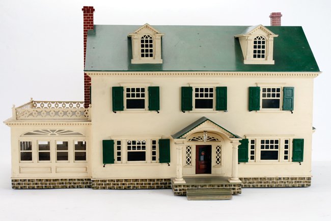 Pennsylvania Colonial Revival Dolls' House: American, circa early 20th century, painted wood structure with pierced metal railing and window frames; As Mrs. Jacobs contends in Antique Dolls' Houses, Flora Gill Jacobs © 2005 on pages 141-143, w