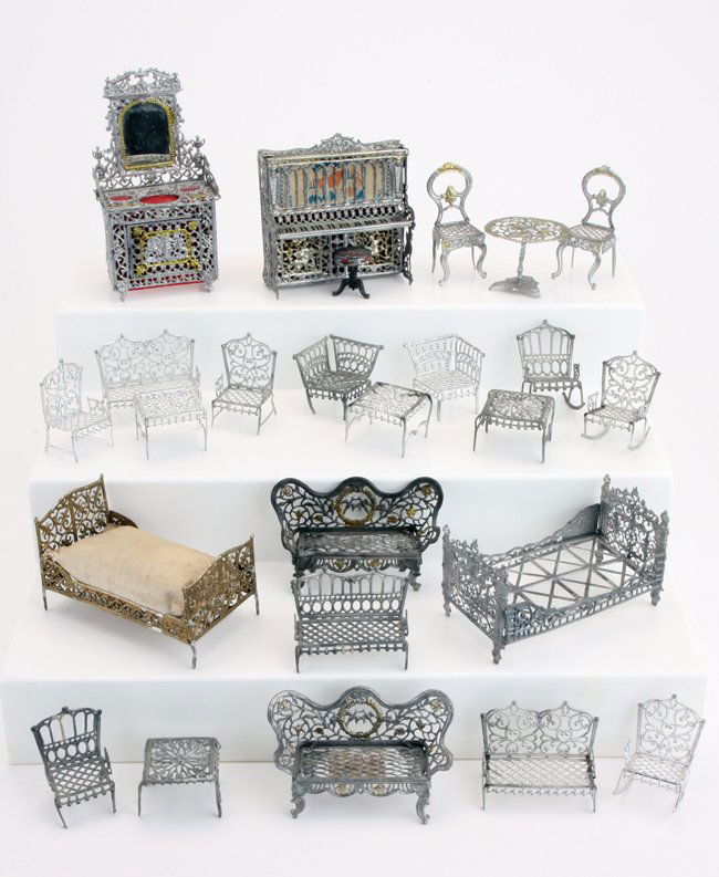 Soft Metal Dolls' House Furniture: various makers, mostly early 20th century furnishings including 2 beds, piano with stool, dressing stand with mirror, and 20 other pieces with settees, chairs, tables etc. beds appr. 3.75" l.
