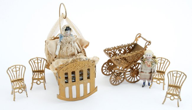 Gilt Metal Cradle, Carriage & Chairs: gilt metal Mexican cradle bed, carriage and 4 side chairs with 2 painted bisque dolls - baby in elaborate gown with lower arms and a little girl in decorated collar dress (small chip on 1 foot) bed 4"