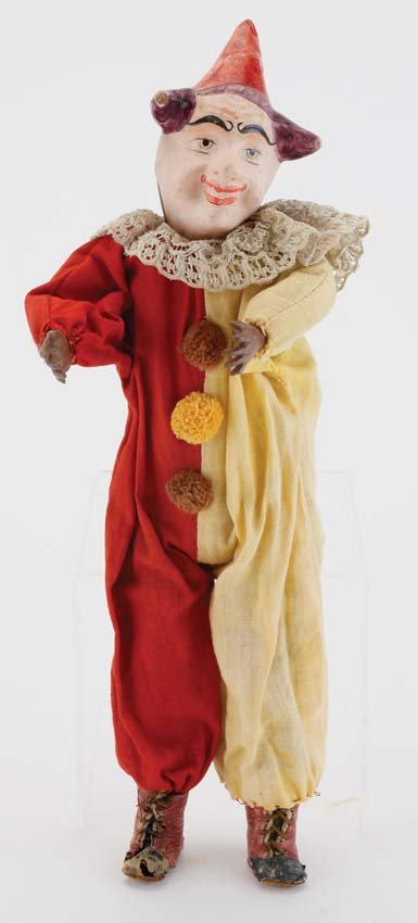 Two Face Clown: a cloth dressed clown of various materials including painted paper mache, head turns to change faces 14" t.