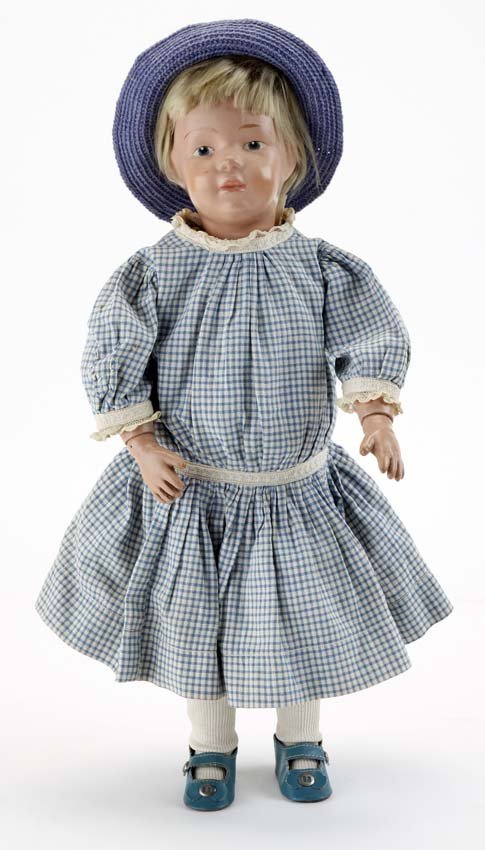 Schoenhut Pouty Girl: painted wood, spring jointed body with painted blue intaglio eyes, nicely redressed in vintage cotton print dress with lace trim and contemporary shoes and hat; original decal on back of shoulder 16"