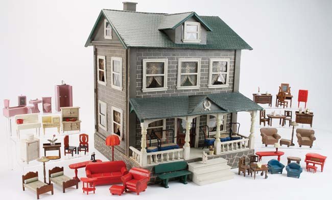 Schoenhut 2 Story Dolls' House - Furnished: American, circa 1923, made of carved and incised painted wood with pressed board shingle pattern roof and frames on all 21 windows ; the eight room interior retains original lace window treatments and