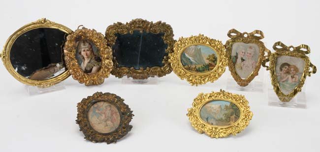 Erhard & Sohne Miniature Framed Pictures: 8 piecess ormolu and brass grouping includes 2 sets of matching frames with original prints, 2 mirrors, an elaborate floral frame and a smaller framed image largest 3.75" x 3"