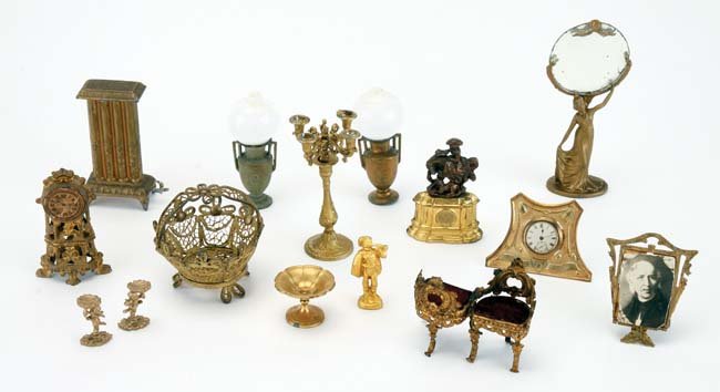 Gilt Metal Dolls' House Accessories: gilt metal items include Gerlach figural mirror, radiator, 2 oil lamps, candelabra and compote along with other ormolu and brass furnishings by various makers including an Erhard & Sohne small scale t