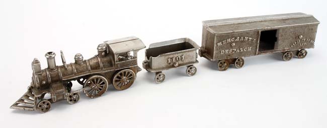 Arcade Floor Train with Box car: nickel plated cast iron, waving engineer in cabin, '1101' tender and 'Merchants Dispatch' box car 25.5" l.