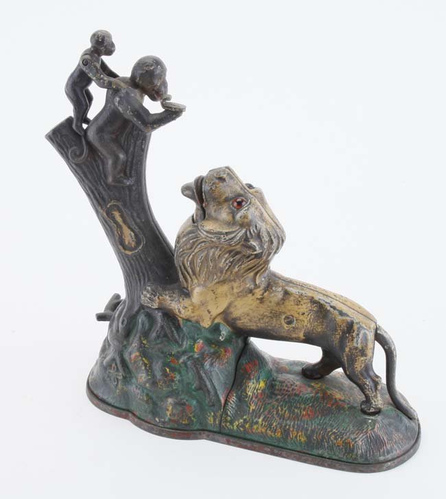 Lion & Monkeys Mechanical Bank: painted cast iron and brass (small monkey) made by Kyser & Rex in Philadelphia 9" t.