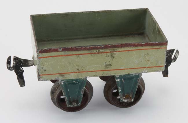 Early Marklin Gondola: early painted tin gauge I gondola with cast iron wheels and original tin couplers body 4" l.