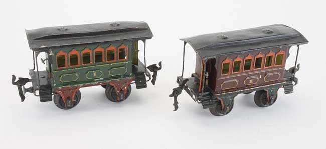 Marklin Gauge I Passenger cars - 2: painted tin coaches with case iron wheels, roofs remove for access to interior bench seats, opening doors front and rear 6" l.