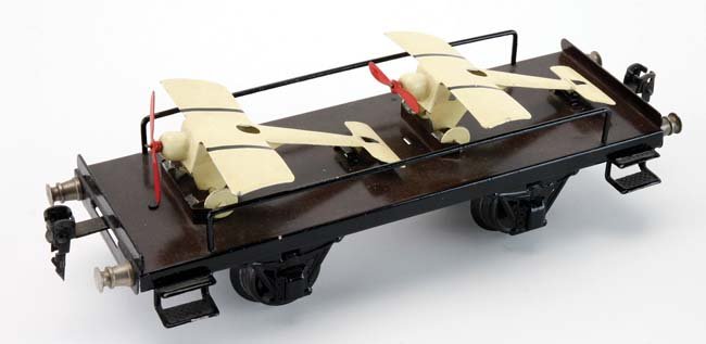 Marklin Airplane Transport Car: painted tin gauge I flat car with 2 airplanes - a scarce car in exceptional original condition as this appears to be, retains 1930's era Marklin stamp 9.5" l.