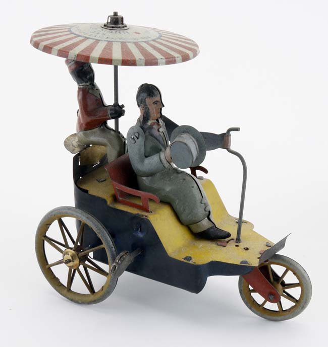 Lehmann New Century Cycle: painted and lithographed tin clockwork toy - man waves hat as figure on rear twirls umbrella 5 l"