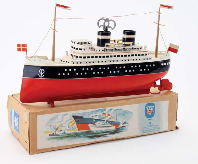 Arnold Ocean Liner with box: painted tin clockwork liner in original box with colorful paper labels - unplayed with - like new condition - box marked in crayon on one side 'For Bon Voyage Party', box retains original printed pric