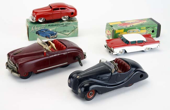 Four Schuco Autos Radio 4012, etc.: includes Radio 4012 with music box, Aukustico 2002 with motor sounds, and 2 with original boxes: Micro Racer Ford - 1045 & Mirakocar 1001 (box taped) radio car 6" l.