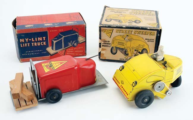 Ny-Lint Sweeper & Lift Truck: heavy tin clockwork toys with rubber tires and original boxes - sweeper branded 'Elgin Street Sweeper', the lift truck has back and forth action and original wood pallet with lumber, sweeper box missi