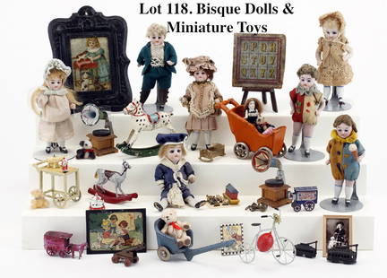 Bisque Dolls & Miniature Toys: 7 jointed bisque body dolls' house children with glass eyes, painted and molded shoes and socks including a pair of twins in early clown jumper suits along with painted cast iron stroller, cart and pu