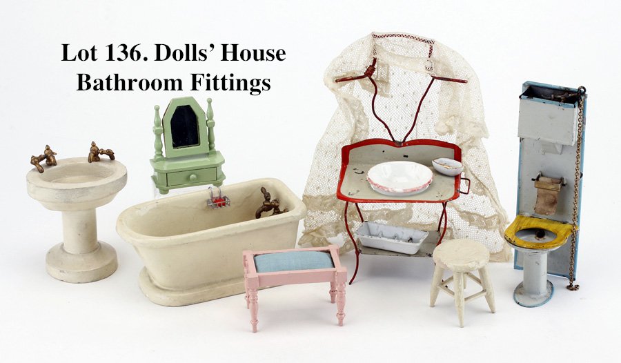 Dolls' House Bathroom Fittings: painted tin and wood grouping includes functioning chain operated toilet with reservoir, dressing stand with period lace netting and china wash basin and soap dishes; wooden pedestal sink, tub, stool 