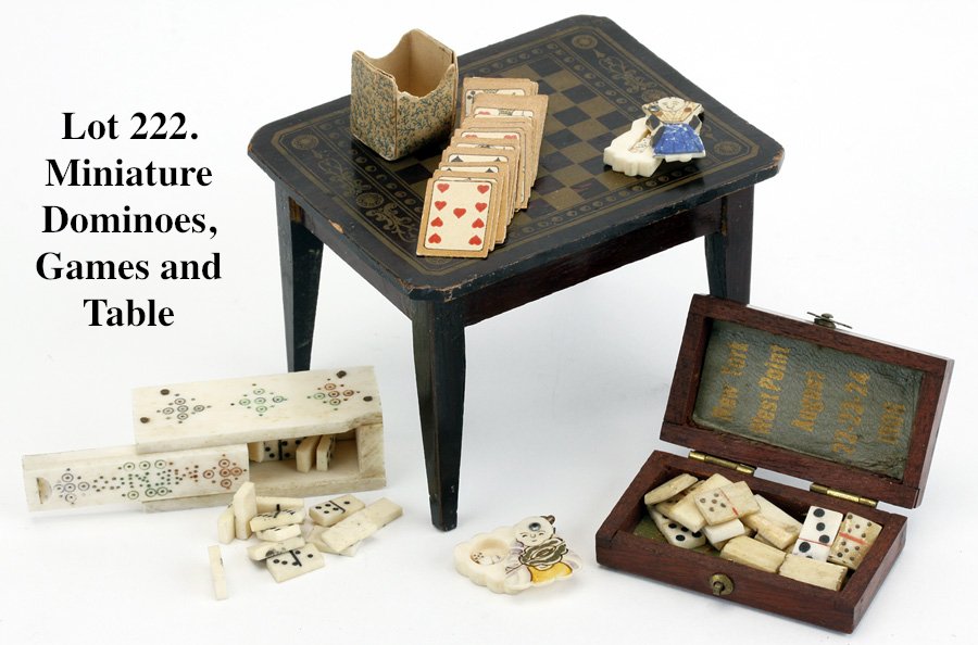 Miniature Dominoes, Games and Table: rosewood toned game table with stenciled top, miniature deck of cards, 2 decorated ivory dice holders, a very finely crafted box with bone dominoes and a decorated ivory box and dominoes (Mexico); Ex 