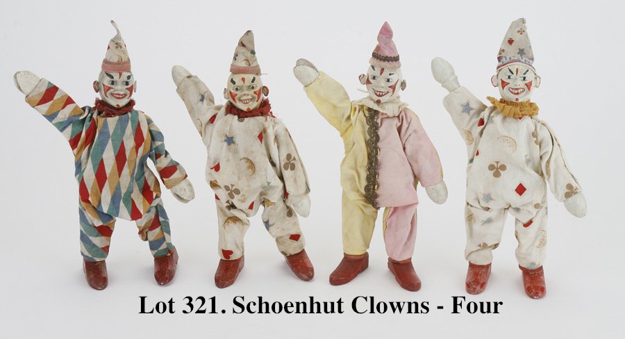 Schoenhut Clowns - 4: cloth dressed jointed wood figures in original costumes, includes 2 two part head and 2 solid head versions 8" t.