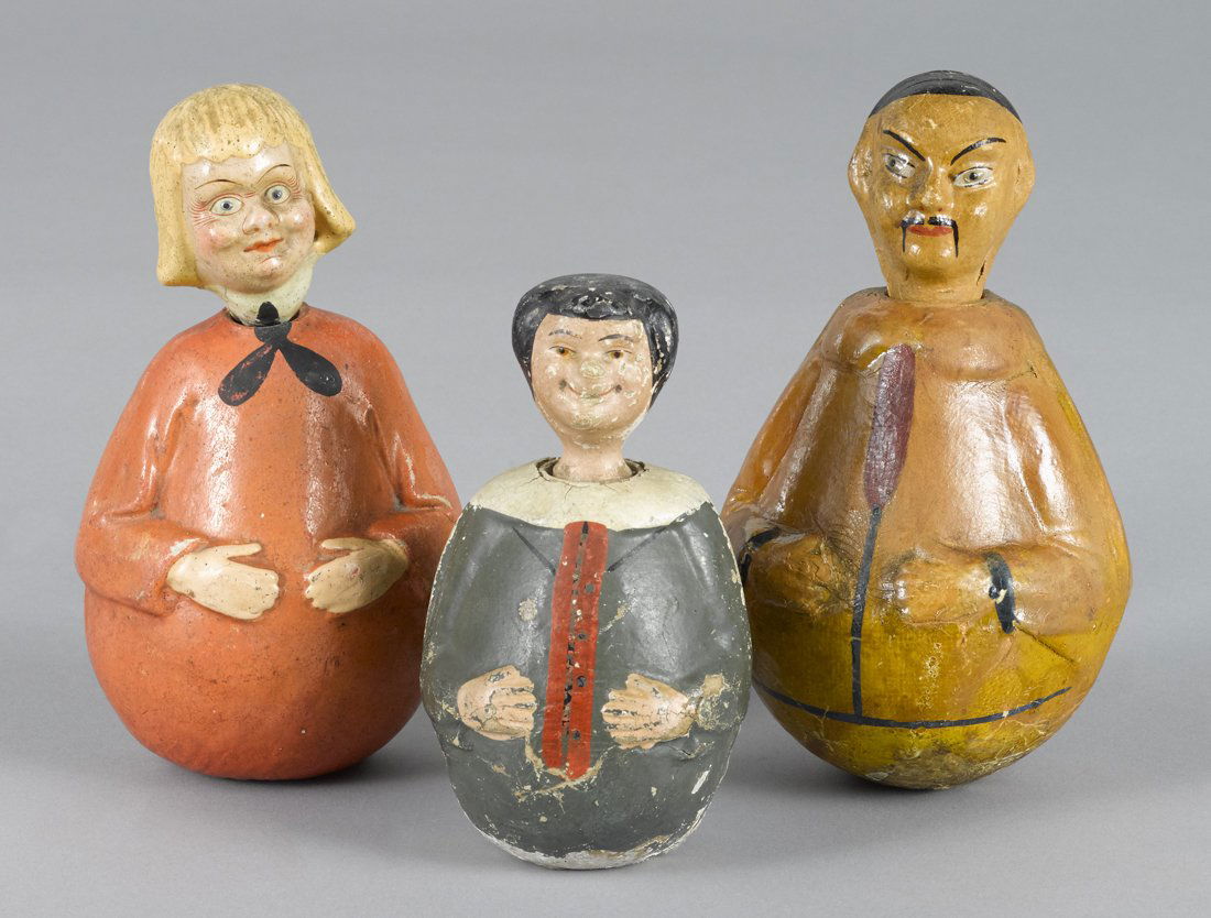 Three Schoenhut composition rolly dollys, to in: Three Schoenhut composition rolly dollys, to include a Chinaman nodder with a ponytail, 7 1/4'' h., a Buster Brown nodder, 7 1/4'' h., and a Max with a two-part head, 5 3/4'' h.