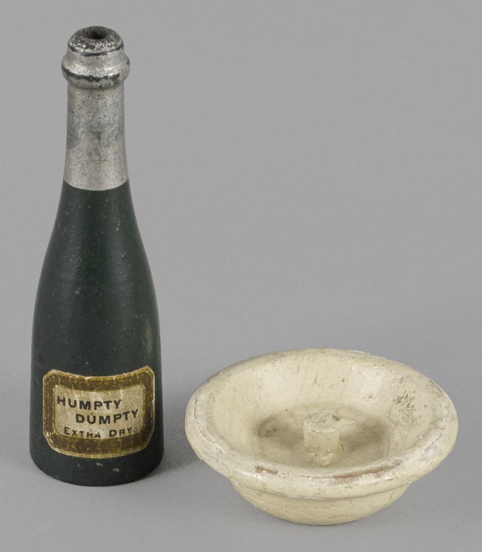 Schoenhut painted wood champagne bottle and spin: Schoenhut painted wood champagne bottle and spinning plate, bottle - 3 1/4'' h.