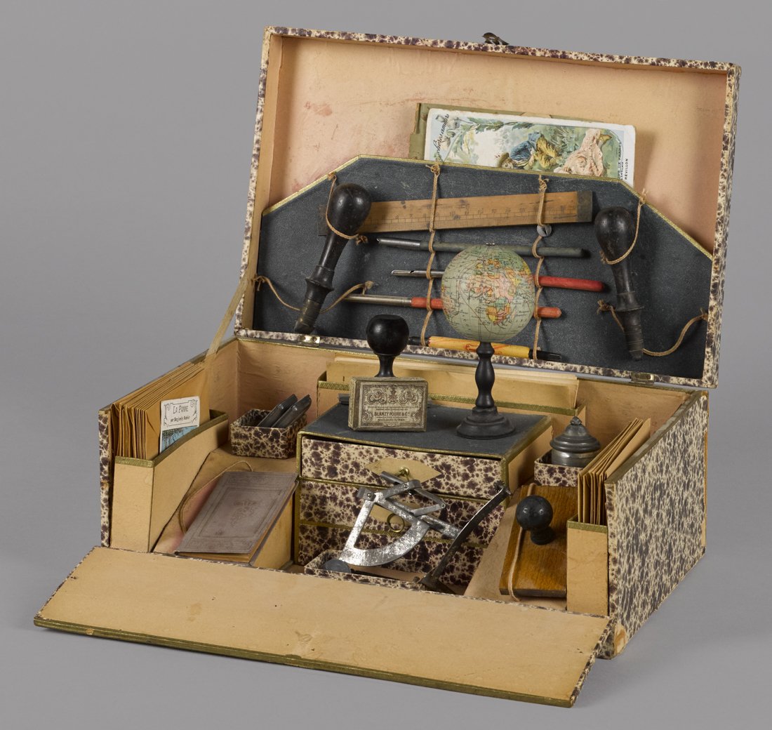 French papeterie (Stationary) play set, in a pr: French papeterie (Stationary) play set, in a presentation box, fitted with an inkwell, a compass, a small globe, a ledger, a ruler, song sheets, envelopes, etc.