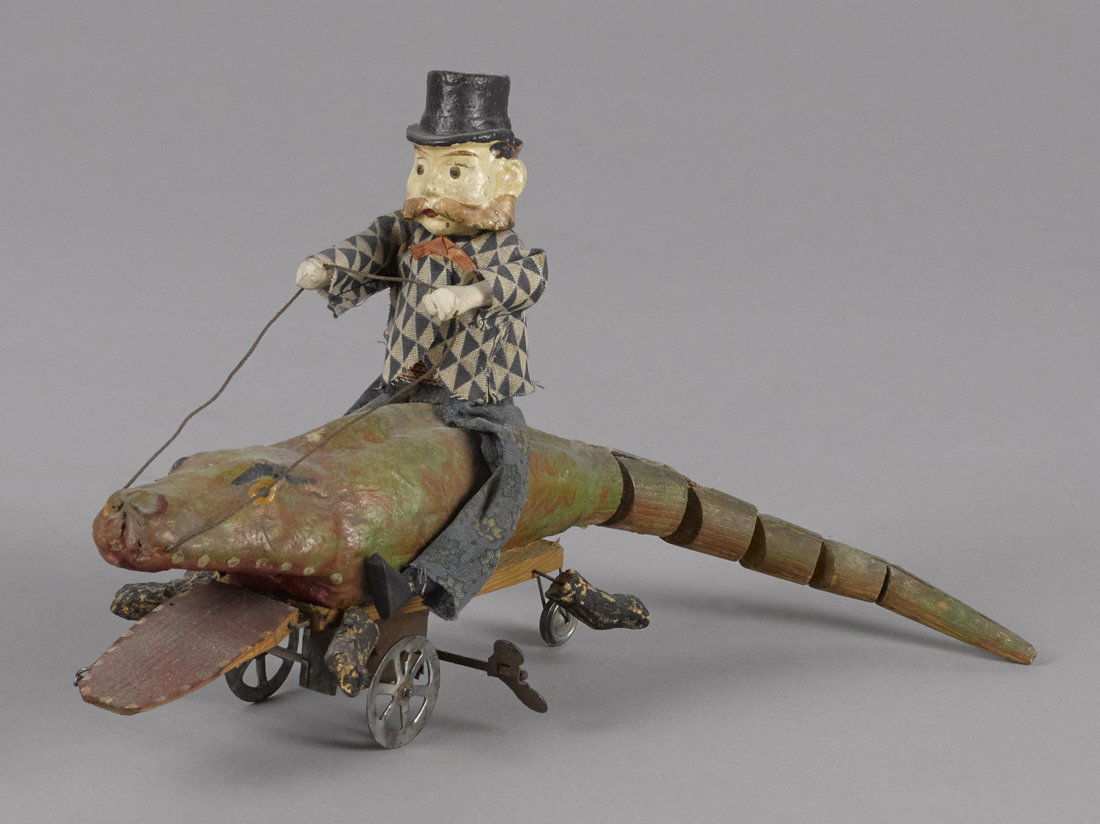Unusual German composition and wood man riding a (1 of 2)