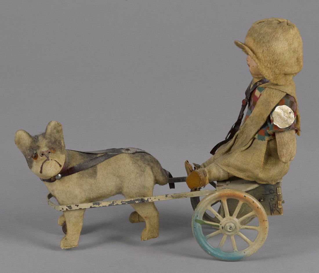 German painted tin and composition clockwork dog (1 of 2)