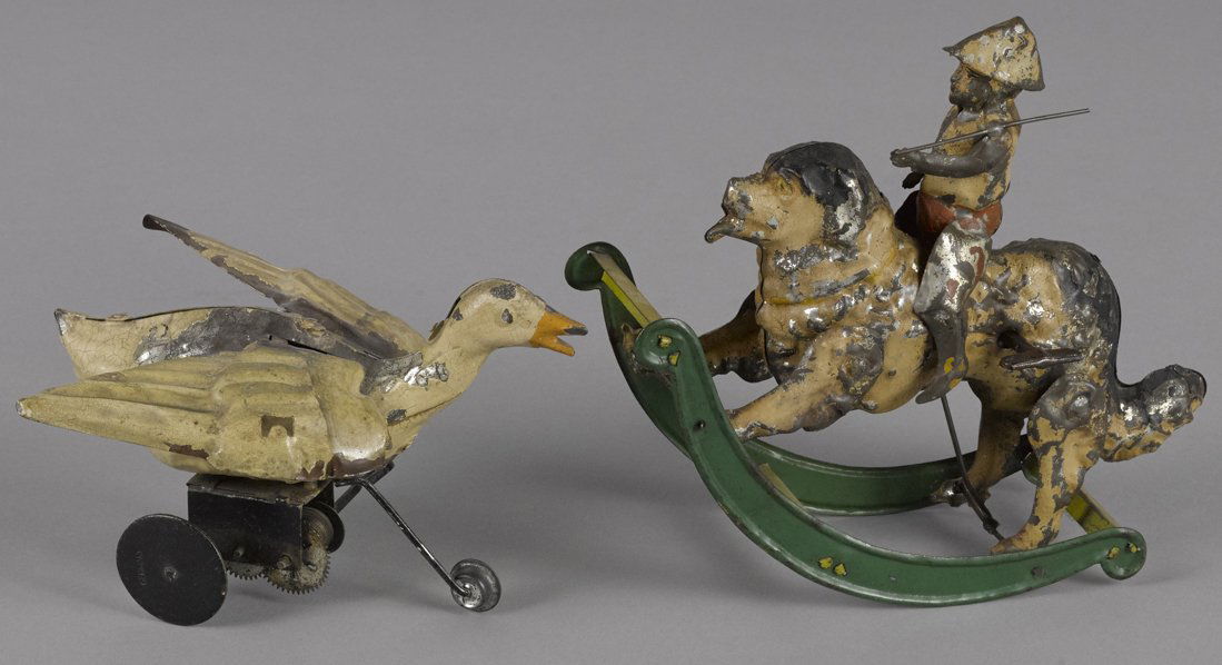 Gunthermann painted tin clockwork boy riding a d (1 of 1)