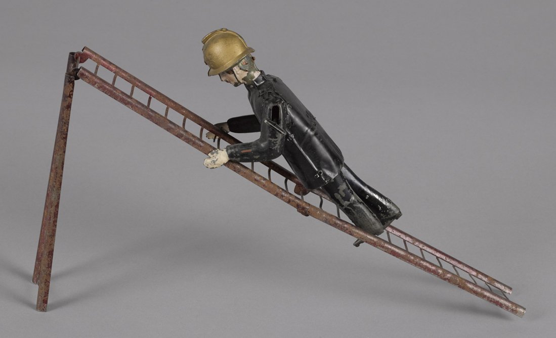 Martin hand painted tin clockwork fireman with f (1 of 2)