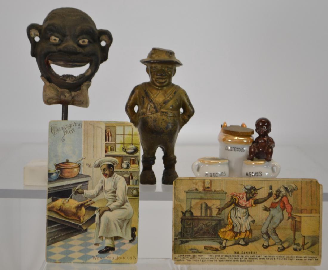 Black Americana Collection: Black Americana cast bottle opener, still bank, cigarette holder, Rising Sun Stove Polish advertising "no Dinner?" and a postcard with 1910 US post mark