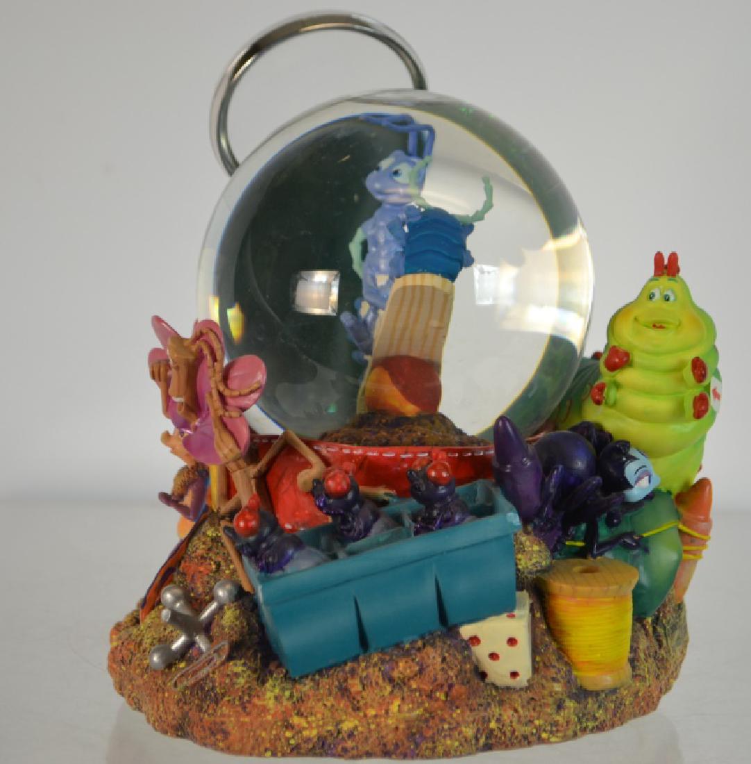 Disney a Bugs Life Snow Globe and Music Box: Disney a Bugs Life Snow Globe 8 1/2" h, no box, music by Randy Newman