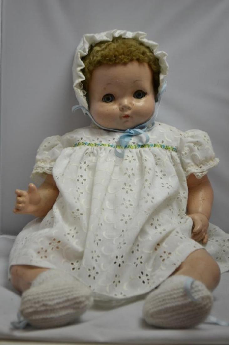 Effanbee Vintage Doll: Effanbee Vintage Doll with a Composite head and limbs, body is stuffed. Sleeper eyes, hand painted eye brows, and lips with vintage clothing. Doll measures approx. 23.25"l