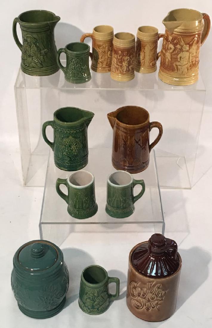Large Collection of Pottery by Various Makers: Large Collection of Pottery by Various Makers including: Redwing Style cookie jar, Jug shaped cookie jar, McCoy pottery, water pitcher, 3 McCoy water pitchers, Hull pottery pitcher and 3 open steins,