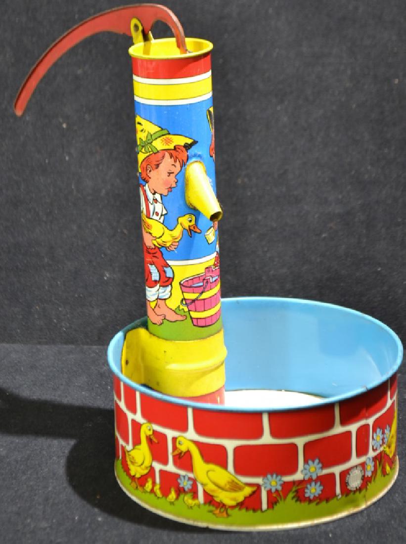 Ohio Arts Waterpump Sand Toy: Ohio Arts Waterpump Sand Toy - Ohio Art Company Bryan, Ohio; functional, measuring 8.25" graphics in superior condition,minor common wear
