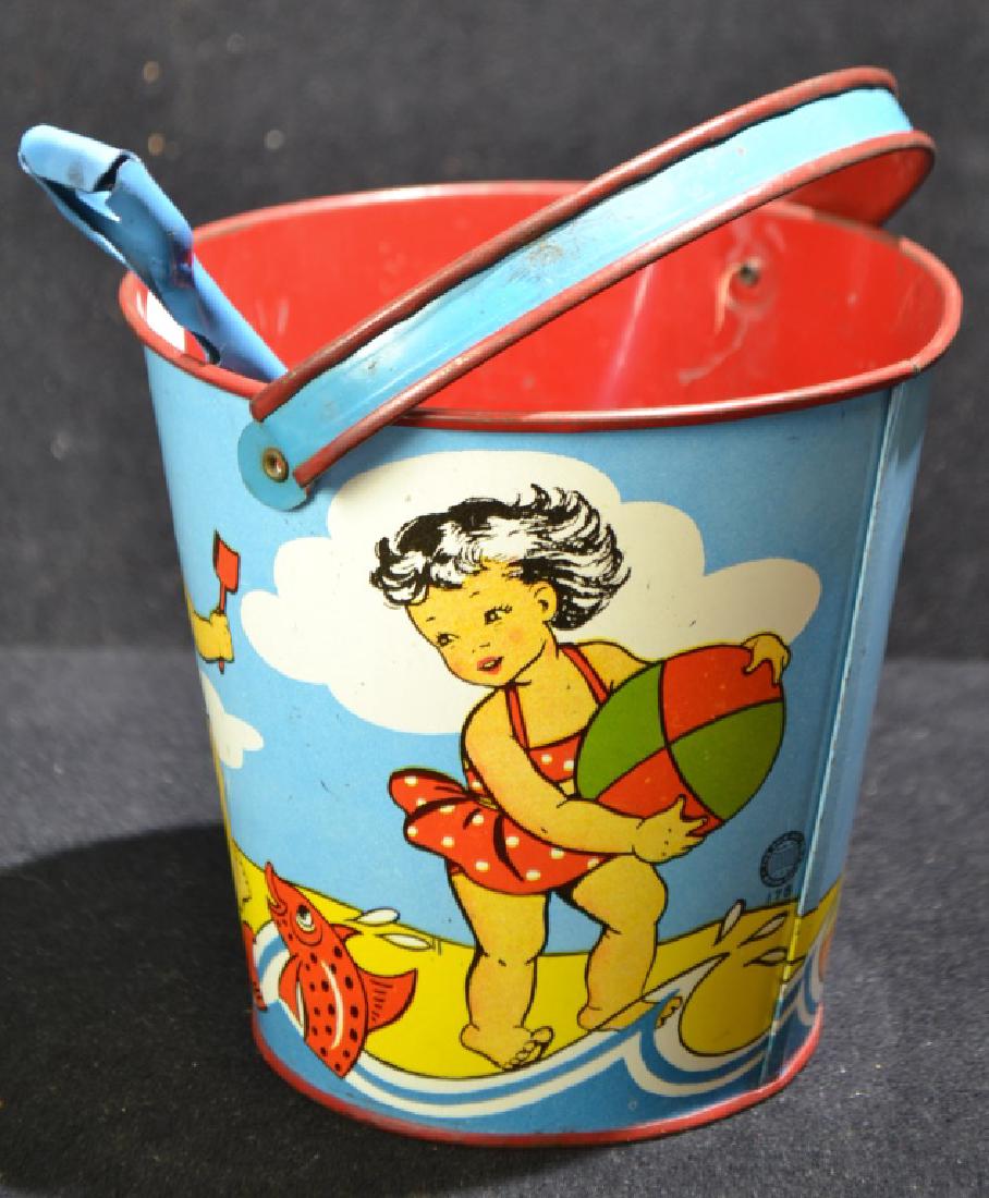 Ohio Arts Tin Litho Sand Bucket with Shovel: Ohio Arts Tin Litho Sand Bucket with Shovel - measuring 5"H, scene of children at the beach, good graphics, minor wear and scratches