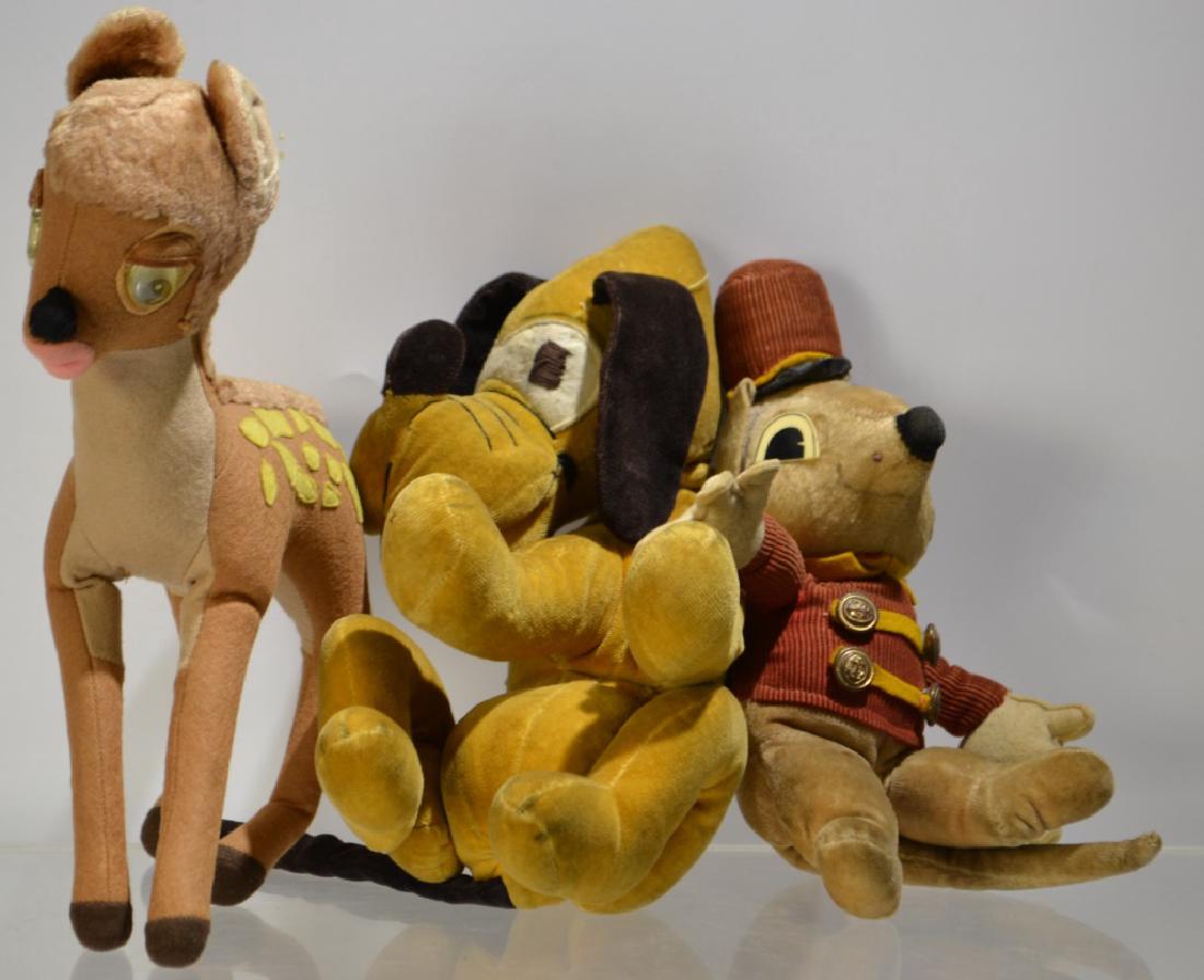 Three First Half 20th Disney Stuffed Toys: a Bambi with rattle eyes, possibly Gund, Timothy the Mouse retaining Walt Disney tag, and Pluto with hinged neck , no tag, possibly Gund - Pluto sits 10.5"H